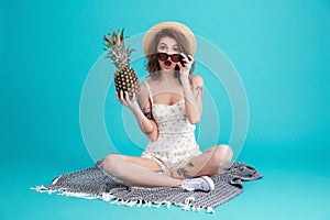 Portrait of a an excited summer girl in beach hat