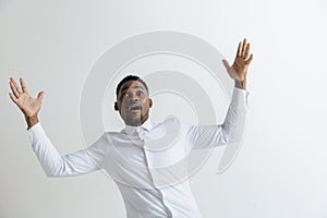 Portrait of excited young African American male screaming in shock and amazement.