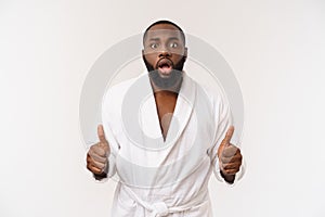 Portrait of excited young African American male screaming in shock and amazement holding hands on head. Surprised black