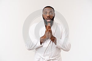 Portrait of excited young African American male screaming in shock and amazement holding hands on head. Surprised black