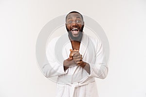 Portrait of excited young African American male screaming in shock and amazement holding hands on head. Surprised black