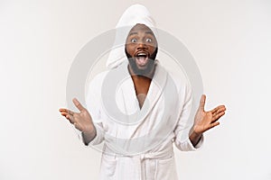 Portrait of excited young African American male screaming in shock and amazement holding hands on head. Surprised black