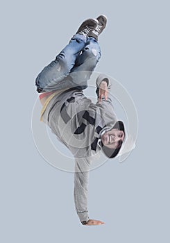 Funny cheerful happy man jumping in air over gray background