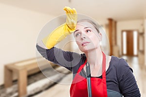 Portrait of exhausted cleaning woman