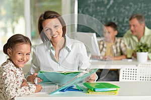 Portrait of experienced teachers working with children