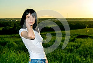 Portrait of expressive beautiful woman against sunset