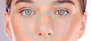 Portrait, eyes and woman in studio for makeup, beauty and skincare treatment closeup. Face, zoom and microblading or