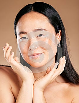 Portrait, face or Japanese woman in beauty, skincare or grooming routine isolated on studio background. Hands, relaxed