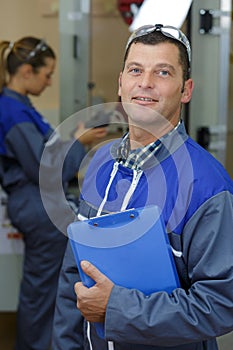Portrait factory worker in component store
