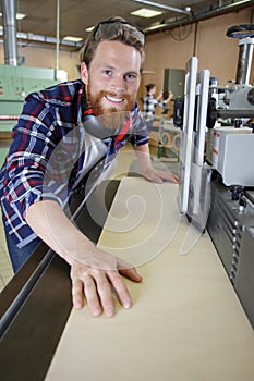 portrait factory worker operating machinery