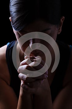 Portrait of a faithful woman praying