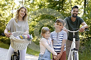 Portrait  of family while bike ride in the woods