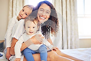 Portrait, family and children smile with mother in home, bonding and having fun together. Happiness, bedroom and baby