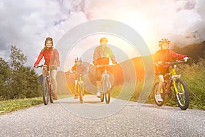 Portrait of Family cycling in countryside