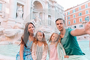 Portrait of family at Fontana di Trevi, Rome, Italy.