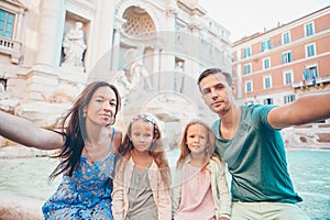Portrait of family at Fontana di Trevi, Rome, Italy.