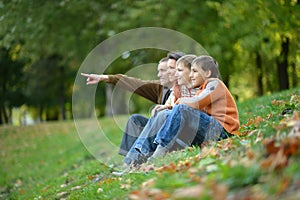 Portrait of family of four in autumn park