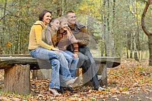 Portrait of family of four in park