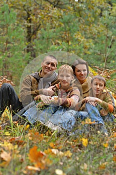 Portrait of family of four in park