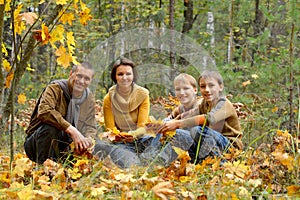 Portrait of family of four in park