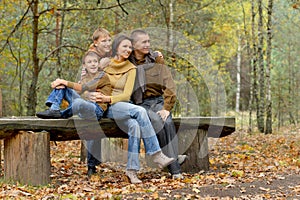 Portrait of family of four in park