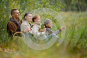 Portrait of family of four in park