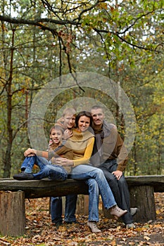 Portrait of family of four in park