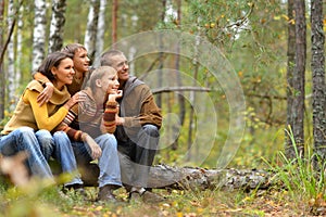 Portrait of family of four in park