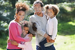 Portrait Of Family Group In Countryside Together