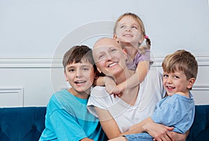 Portrait of family with mother recovering from cancer in center