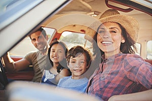 Portrait Of Family Relaxing In Car During Road Trip