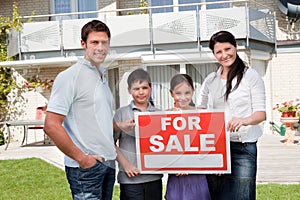 Portrait of family selling their house