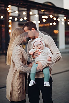 Portrait of family standing together in cosiness atmosphere.