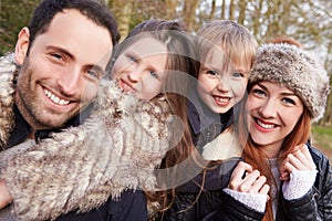 Portrait Of Family On Winter Countryside Walk Together