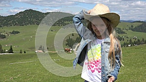 Portrait of Farmer Child Puts Her Cowboy Hat on, Cowherd Face Girl on Field 4K