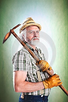 Portrait of farmer with his mattock