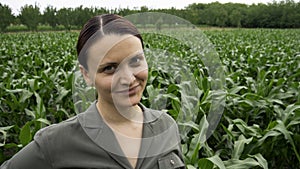 Portrait of farmer woman in field of corn