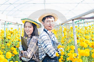 Portrait farmer young woman and man worker smiling in uniform standing arms crossed