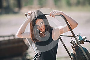 Portrait of Fashion Model Girl on the Industrial Background.