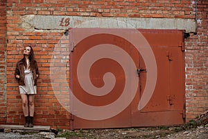 Portrait of Fashion Model Girl on the Industrial Background.