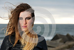 Portrait of a fashion model with wind blowing long hair