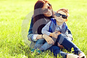 Portrait of fashionable baby boy and his stylish mother