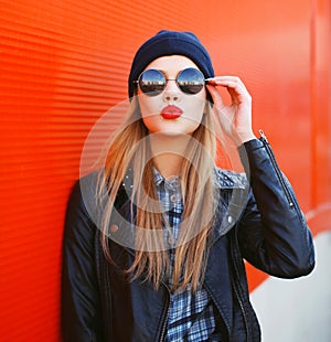 Portrait of fashionable blonde girl with red lipstick