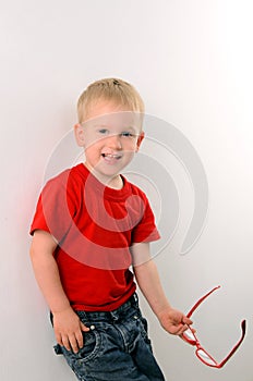 Portrait of fashionable little boy with glasses