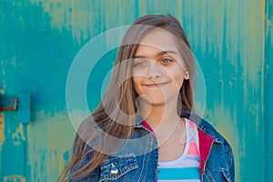 Portrait of fashionable teen girl with long hair.