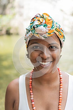 Portrait of a fashionable young African girl. She wears a colored scarf