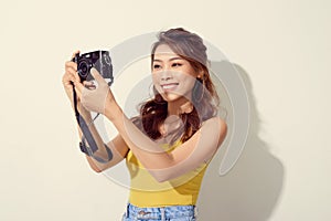 Portrait of fashionable young photographer with  digitalcamera