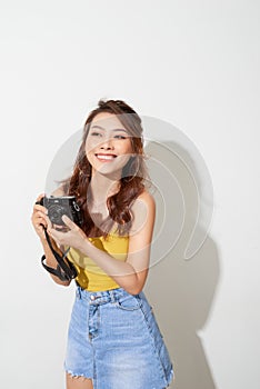 Portrait of fashionable young photographer with  digitalcamera