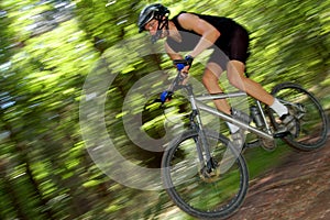 Portrait of fast moving cyclist