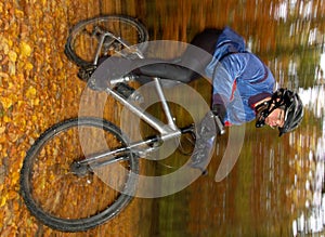 Portrait of fast moving cyclist